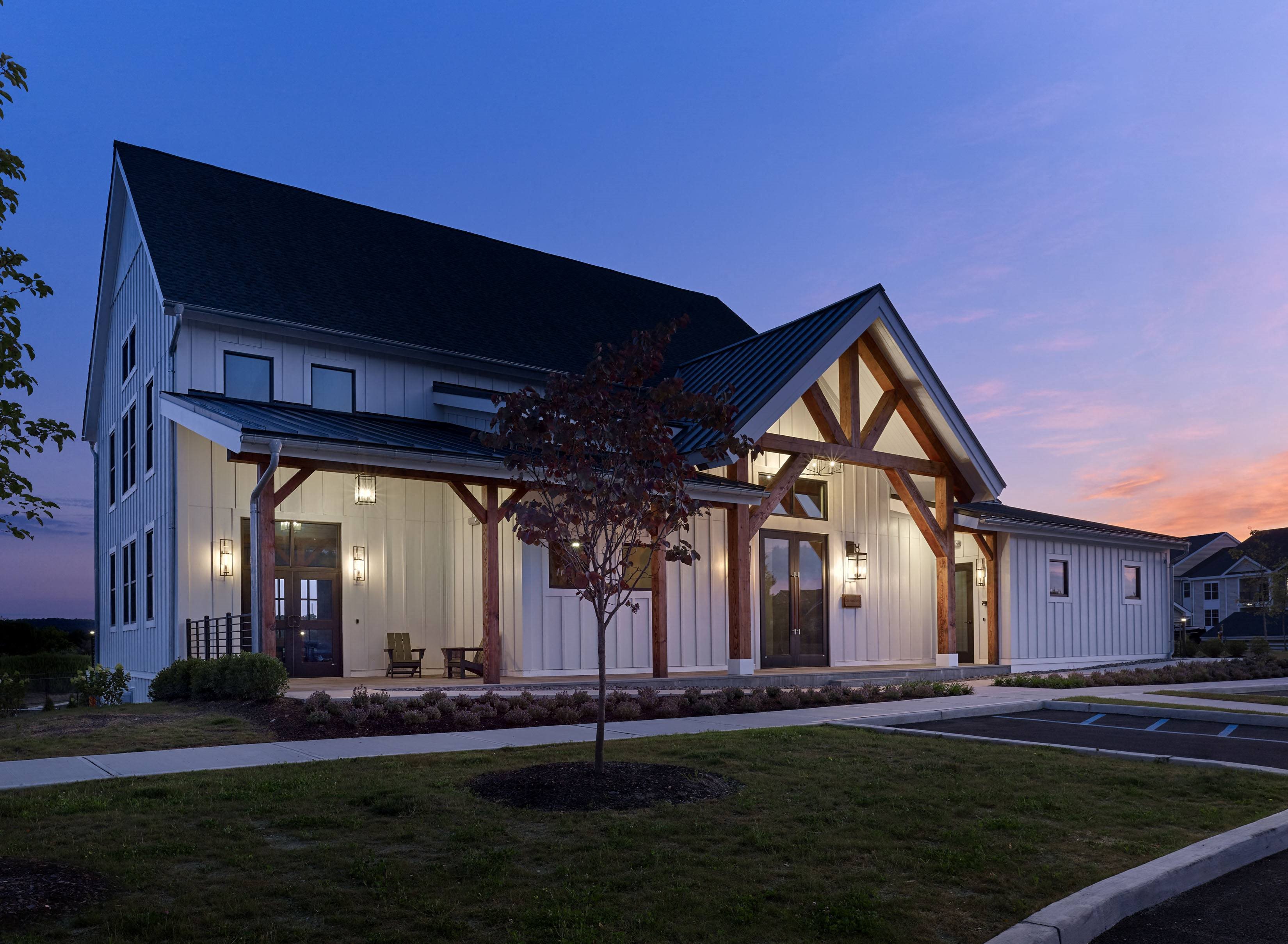 a view of the front of a building at dusk